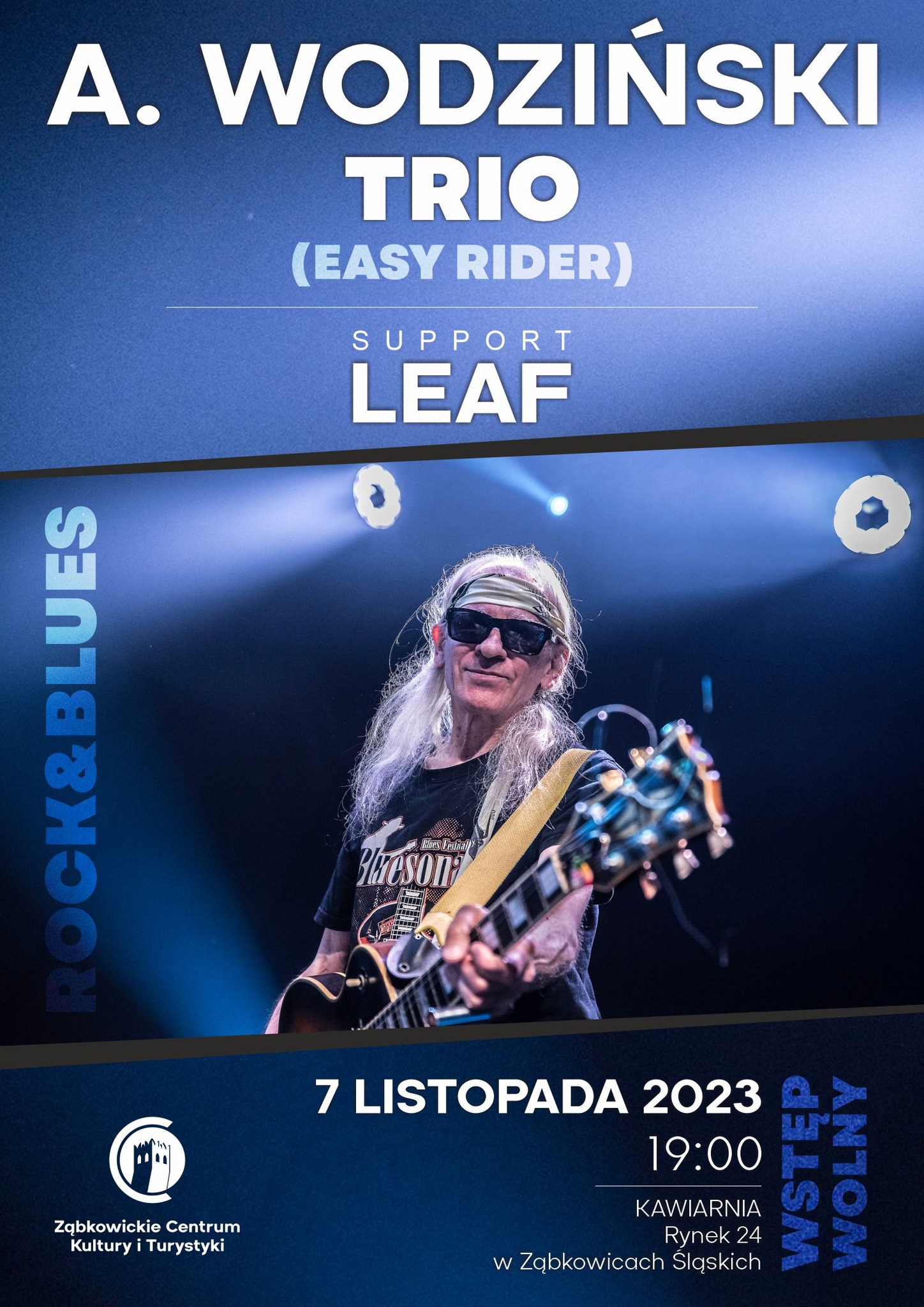 Plakat informujący o koncercie Andrzeja Wodzińskiego "Easy Rider" 7 listopada 2023 o godzinie 19:00 w kawiarni Ząbkowickiego Centrum Kultury i Turystyki. Na plakacie znajduje się mężczyzna w siwych, długich włosach, czarnej koszulce i okularach przeciwsłonecznych, trzymający gitarę.
